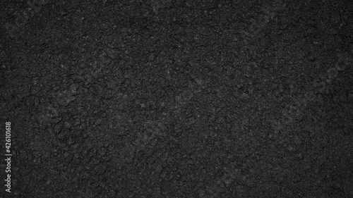 Surface grunge rough of asphalt, Seamless tarmac dark grey grainy road, Driveway texture background, Top view  © Jomic