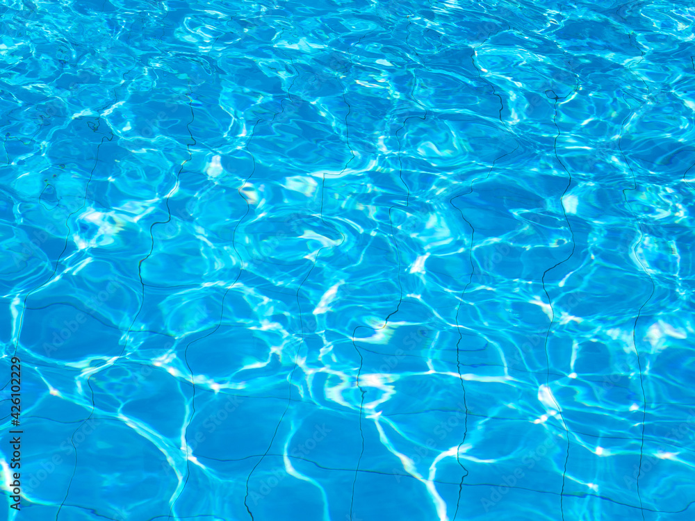 Background of rippled water in swimming pool . Blue ripped water in swimming pool