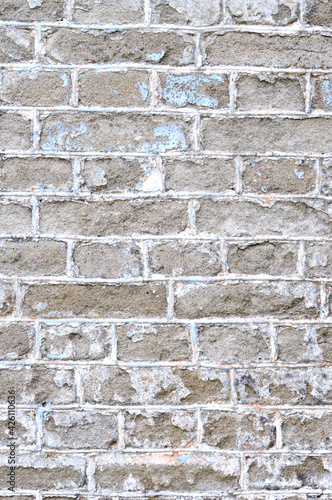 Old brick wall. Ancient stone texture background. Urban background, white ruined industrial brick wall with copy space. Home and office design backdrop. Vintage effect. Vertical photo