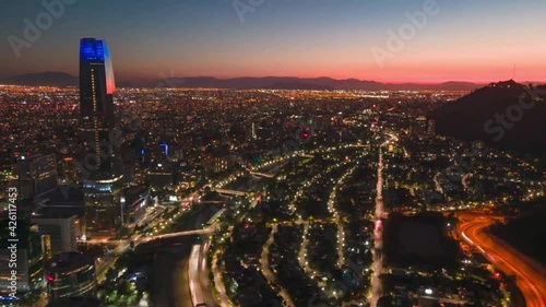 Hyperlapse from a drone over financial district over Santiago de Chile at sunset with cars in the streets