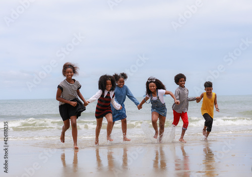 Group on teenager walking relax on the beach. Holiday and vacation concept.