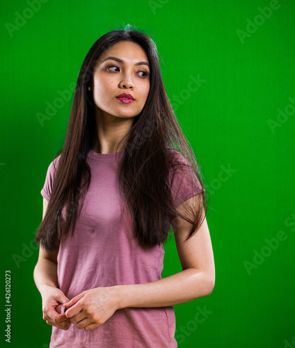 Young pretty woman posing for the camera in a studio - studio photography