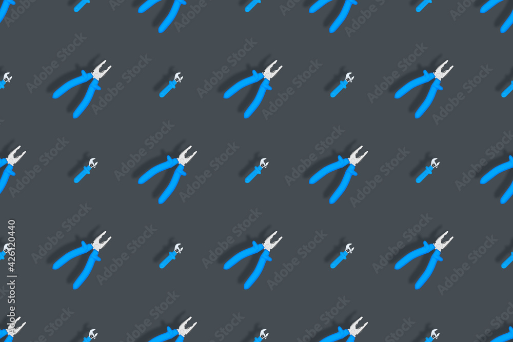 Fototapeta premium Tools seamless pattern. Background made of tools, pliers and an adjustable wrench.
