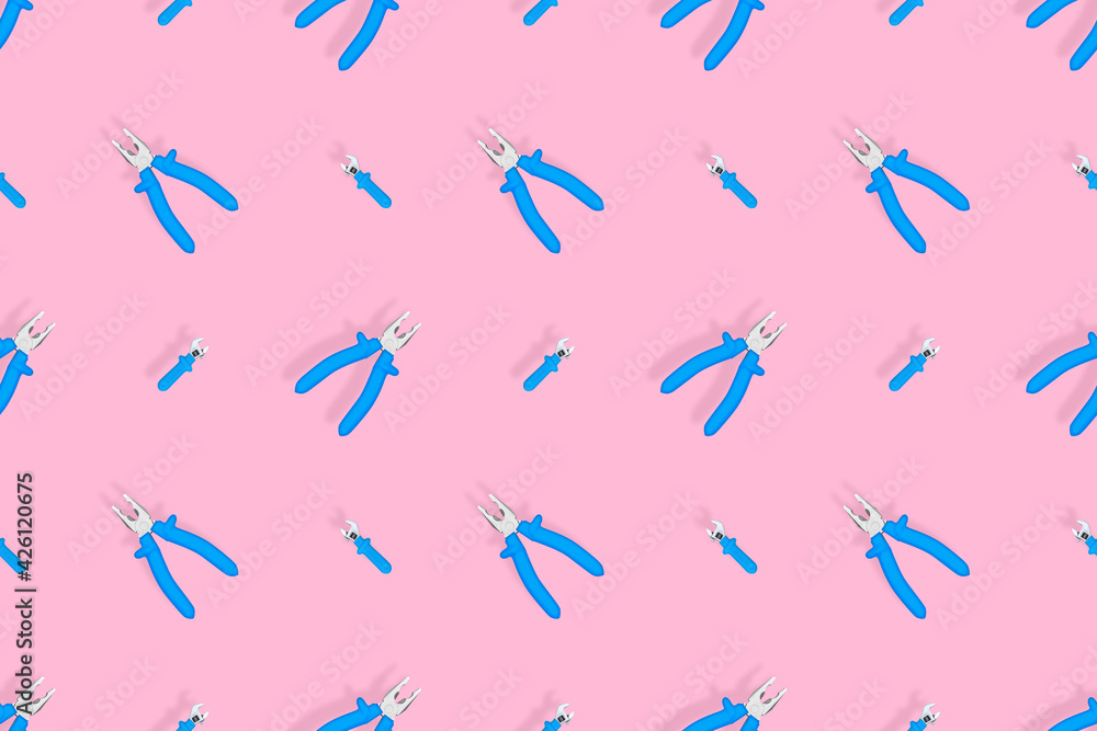 Tools seamless pattern. Background made of tools, pliers and an adjustable wrench. Tools seamless pattern. Background made of tools, pliers and an adjustable wrench.