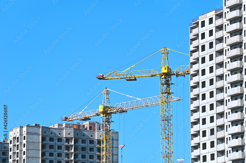 Crane and highrise construction site Crane and highrise construction site