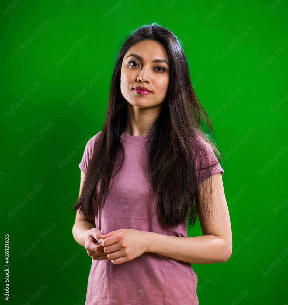 Young pretty woman posing for the camera in a studio - studio photography Young pretty woman posing for the camera in a studio - studio photography