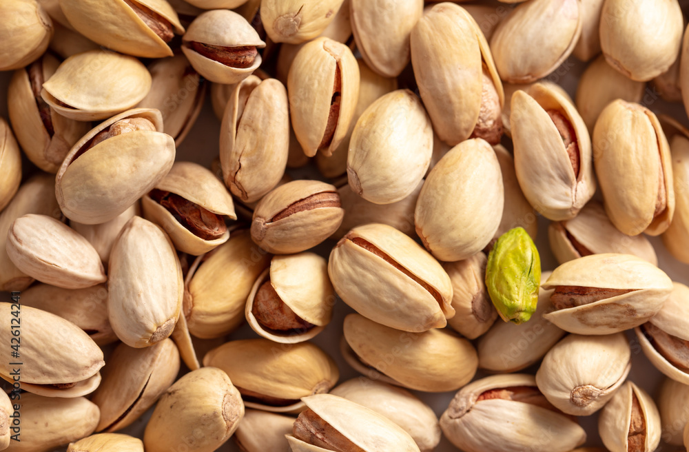 Close-up of fresh pistachio nuts as background. Close-up of fresh pistachio nuts as background.