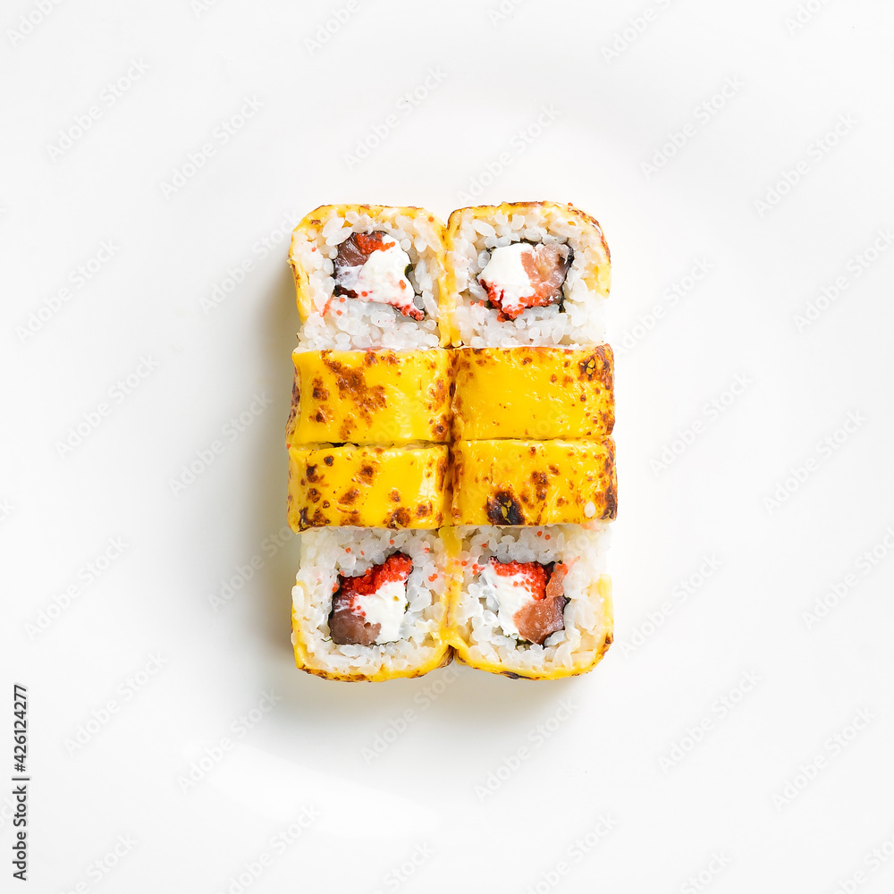 Traditional sushi rolls with cheese. Japanese food. Top view. On a white background. Traditional sushi rolls with cheese. Japanese food. Top view. On a white background.