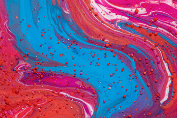Top view of colorful vibrant rocks on a bright red surface for wallpapers and backgrounds