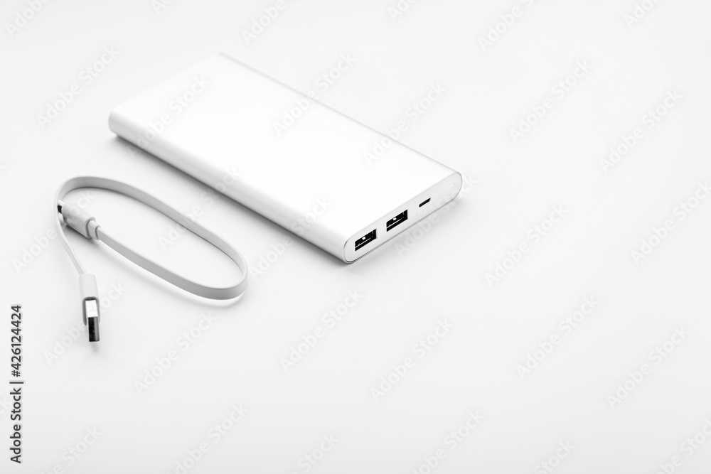 Fototapeta premium Gray Power Bank on white background free space