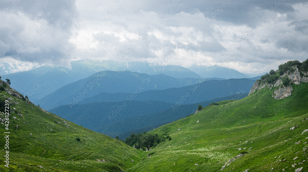 summer landscape panoramic view on a cloudy day in the valley mountains. Adygea, Russia summer landscape panoramic view on a cloudy day in the valley mountains. Adygea, Russia