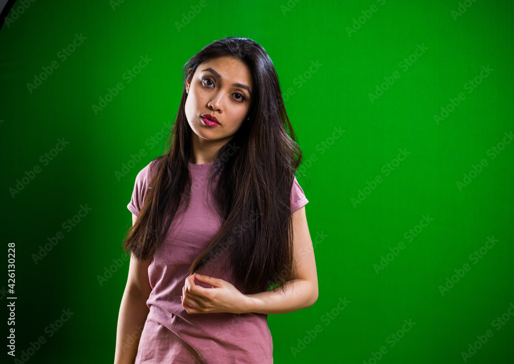 Young pretty woman posing for the camera in a studio - studio photography Young pretty woman posing for the camera in a studio - studio photography