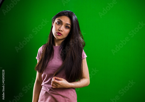Young pretty woman posing for the camera in a studio - studio photography © 4kclips
