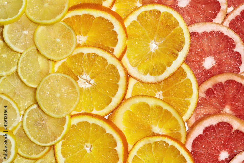 Citrus background. Fresh sliced fruits. Lemons, oranges and grapefruits. Diet, vitamin C concept Citrus background. Fresh sliced fruits. Lemons, oranges and grapefruits. Diet, vitamin C concept
