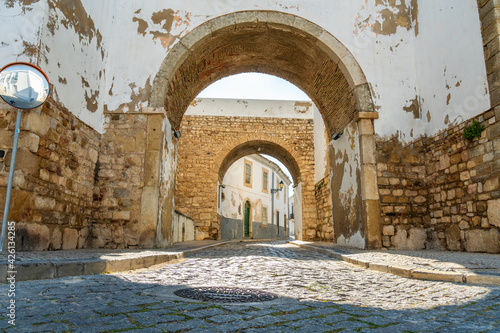 Entrance through medieval walls to historic downtown of Faro, Algarve, Portugal