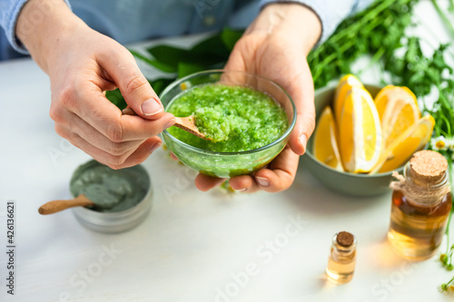 Process of preparation of homemade refreshing cucumber mask. Self care, home face and body treatment durine lockdown. Concept of natural organic ingredients and essential oil in cosmetics. Close up