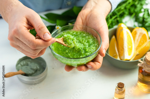 Process of preparation of homemade refreshing cucumber mask. Self care, home face and body treatment durine lockdown. Concept of natural organic ingredients and essential oil in cosmetics. Close up