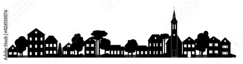 Small Town silhouette cutout skyline with chapel houses trees black and white