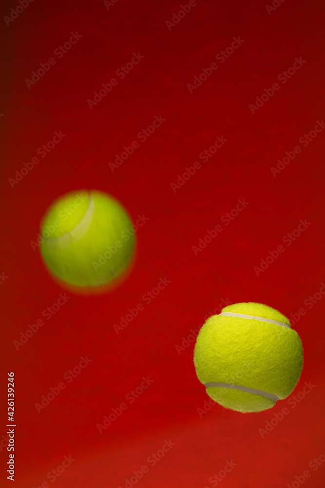 Tennis ball isolated on orange background