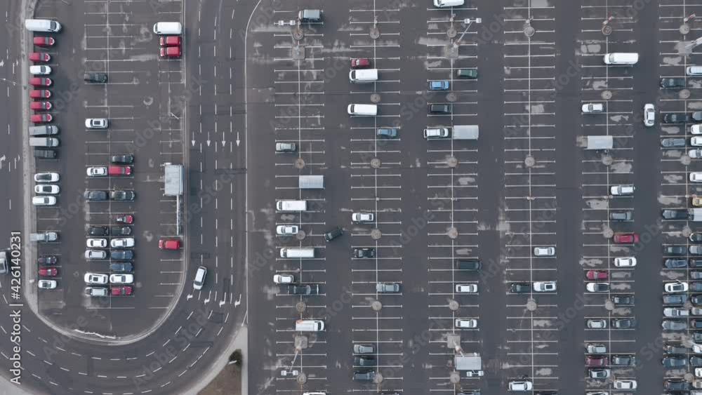 AERIAL: Traffic near Half Empty Parking Lot AERIAL: Traffic near Half Empty Parking Lot
