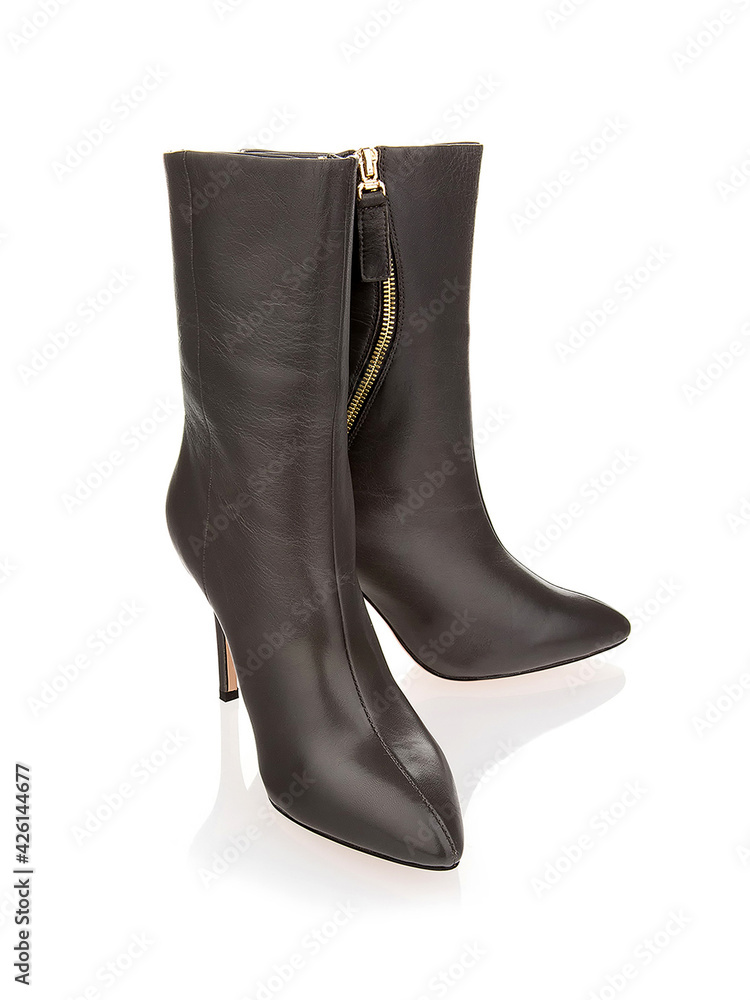 Pair of female black leather boots isolated Pair of female black leather boots isolated