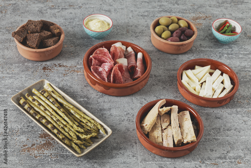 Set of tapas appetizer and snacks prepared at home in ceramic bowls. Set of tapas appetizer and snacks prepared at home in ceramic bowls.