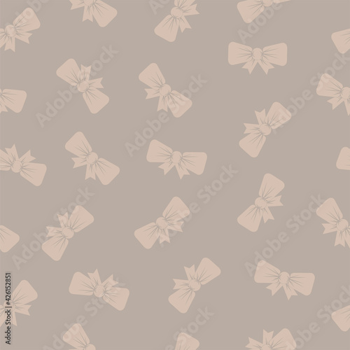 Seamless pattern with bows on a beige background