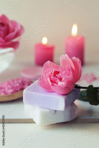 Fresh roses, candles and ingredients for skin care, healthy lifestyle, alternative medicine