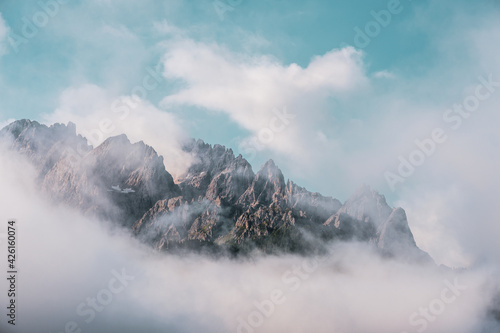 Clouds over mountain peaks in the Dolomites, Italy.