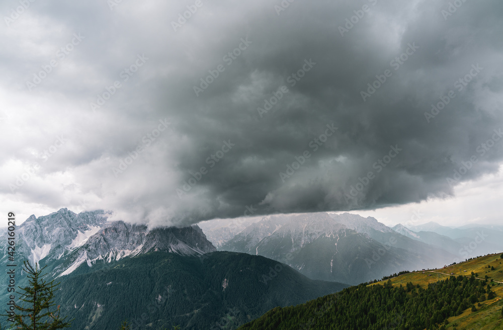 Rain wall and downpour in the Sexten Dolomites, Italy.