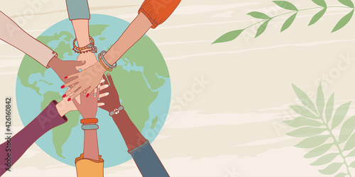 Group of hands on top of each other of people of diverse culture and multiethnic over a earth globe.Financial fund for the environment and clean energy.Growth.Cooperation concept