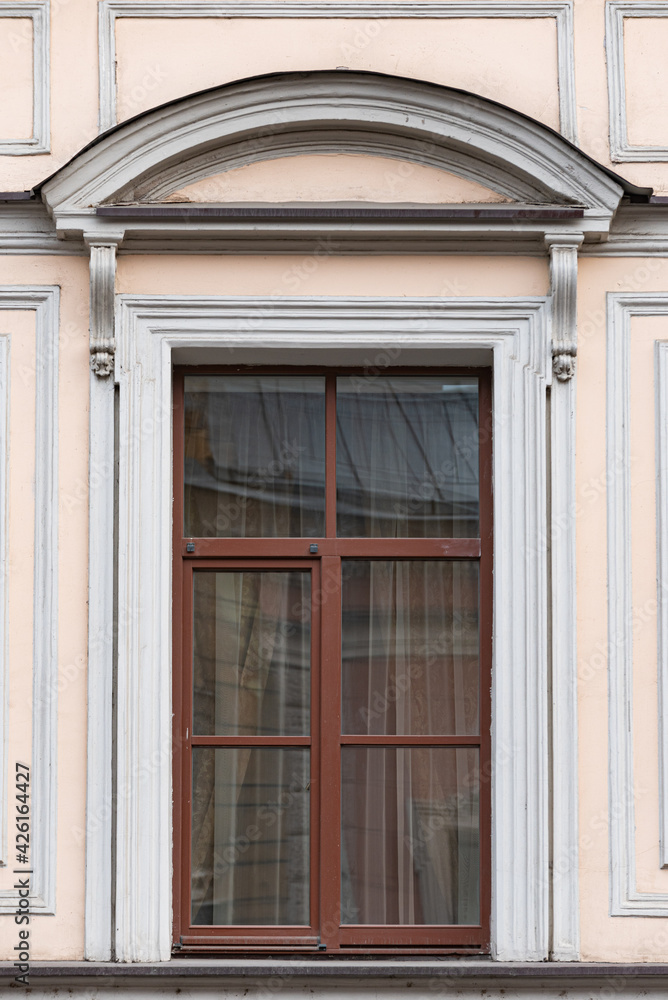 Windows on old city facades, with decorative elements Windows on old city facades, with decorative elements