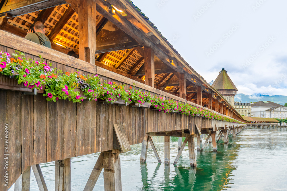 Famous Chapel Bridge in the historic city center of Lucerne with, the city's symbol and one of Switzerland's main tourist attractions and views, Canton of Lucerne, Switzerland