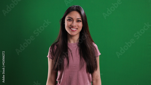 Young pretty woman looks very happy - studio photography