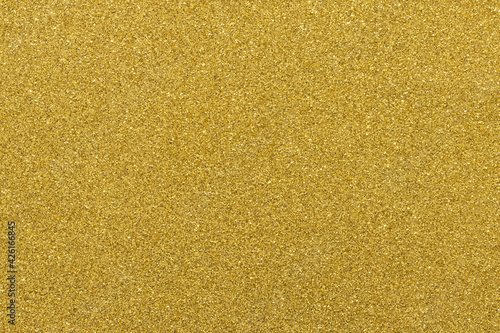 Gold festive background, macro, texture close-up. Copy space for text. Horizontal or vertical. Celebration, holidays, sales, fashion concept, harvesting for mock up