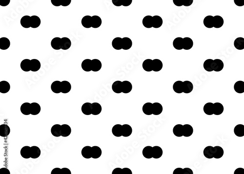 black small circles on a white background. Seamless background. For paper and fabric design.