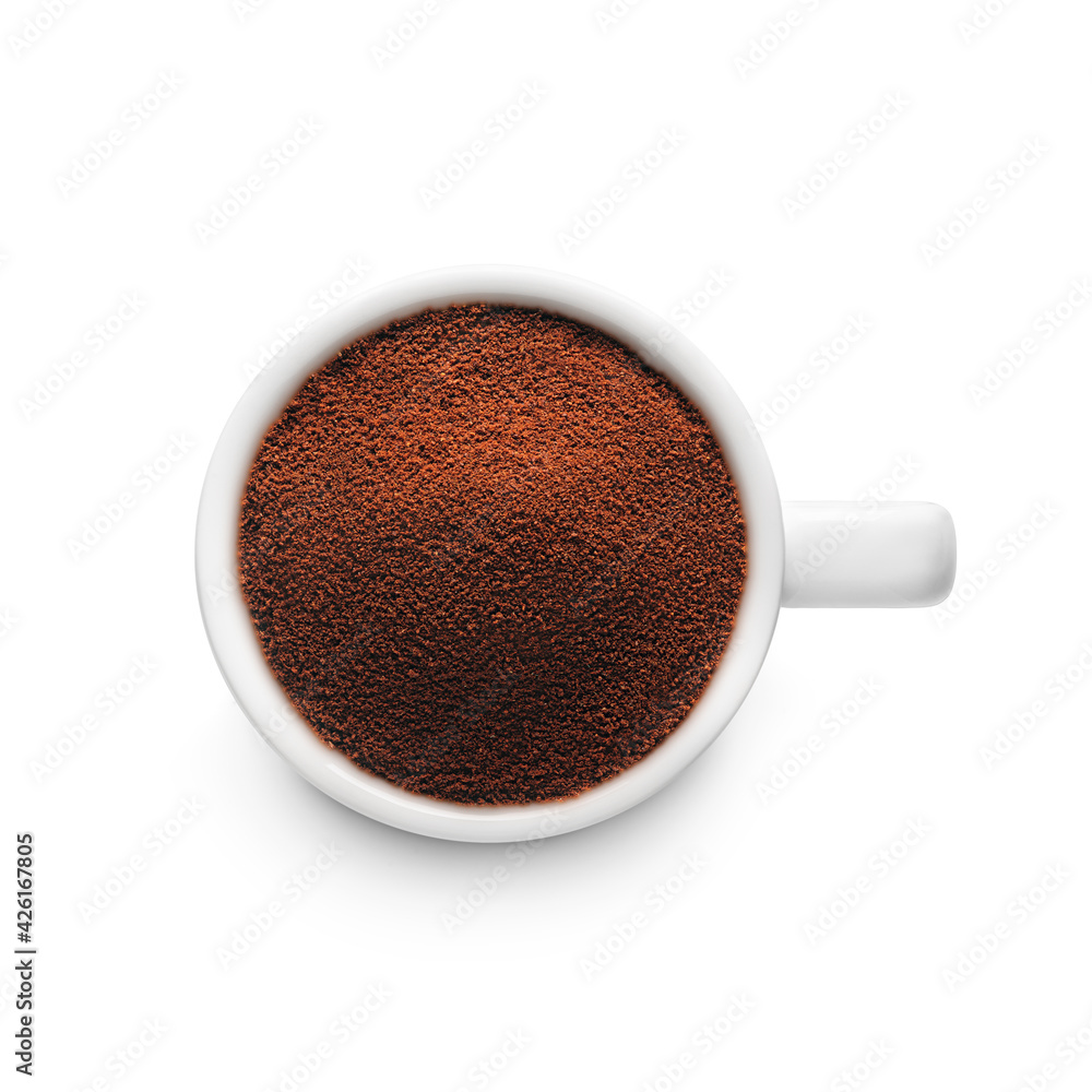 White cup with ground coffee White cup with ground coffee