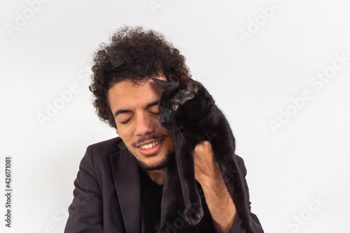 Papier peint Black man with black t-shirt and blazer on white background with black cat