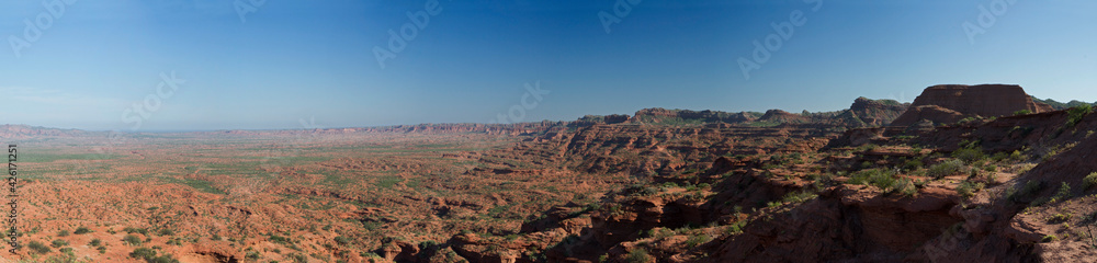Panorama view of the red and orange desert. The sandstone cliffs, canyon and rocky mountains in Sierra de las Quijadas national park in San Luis, Argentina.