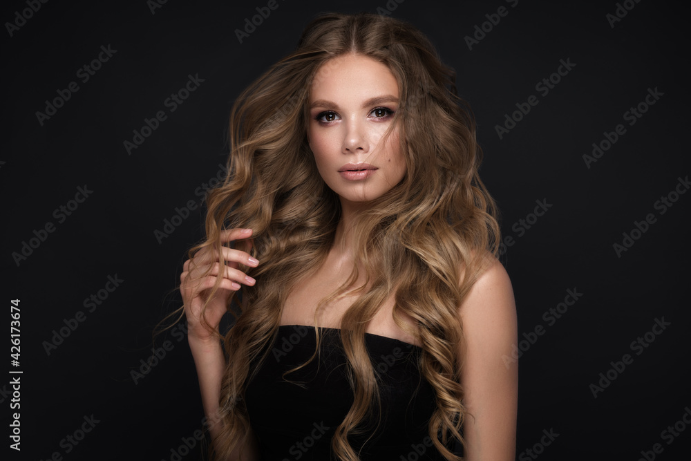 Beautiful blond girl with a perfectly curls hair, and classic make-up. Beauty face and hair. Beautiful blond girl with a perfectly curls hair, and classic make-up. Beauty face and hair.