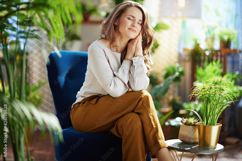 relaxed trendy woman with long wavy hair at home in sunny day relaxed trendy woman with long wavy hair at home in sunny day