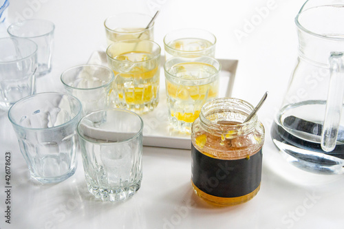 glasses for refreshing summer lemon, yuzu juice. White background
