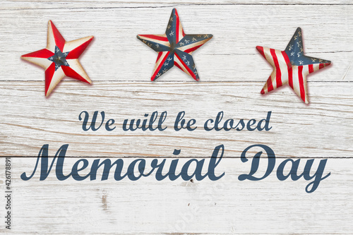 Closed Memorial Day sign with retro American USA flag stars on weathered wood