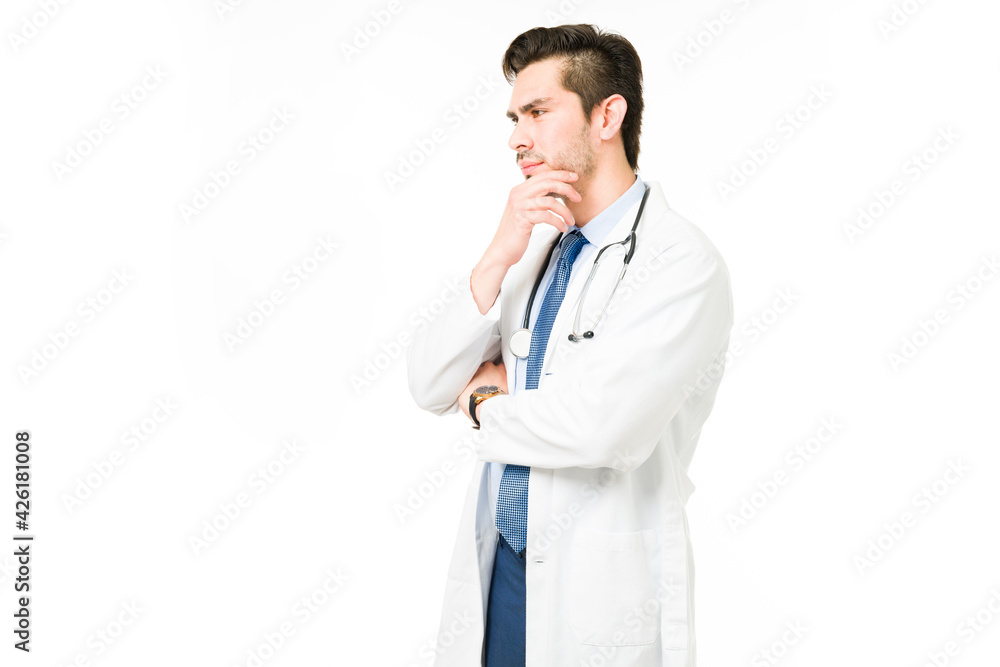 Profile of a professional doctor thinking about a sick patient Profile of a professional doctor thinking about a sick patient