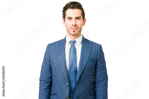 Handsome business man standing in a white background