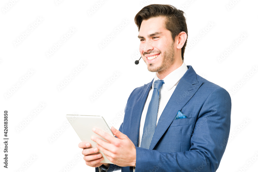 Attractive man working as a salesperson with a tablet Attractive man working as a salesperson with a tablet