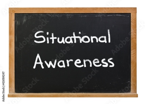 Situational Awareness written in white chalk on a black chalkboard isolated on white