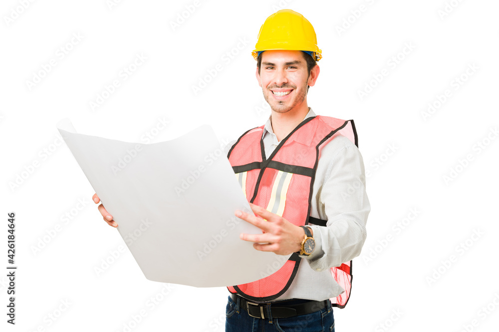 Portrait of a cheerful architect checking the construction plans Portrait of a cheerful architect checking the construction plans