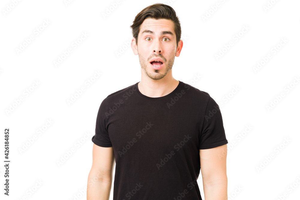 Hispanic young man can't believe the news he received Hispanic young man can't believe the news he received