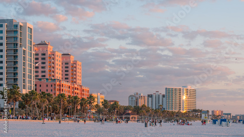 Fototapeta Naklejka Na Ścianę i Meble -  Island Clearwater Beach FL. Ocean or Gulf of Mexico shore. Spring break or Summer vacations in Florida. Hotels, restaurants and Resorts. Tropical Nature with palm trees. United States of America.